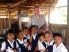 Brother Chris McGuire with school children in Berbice.
